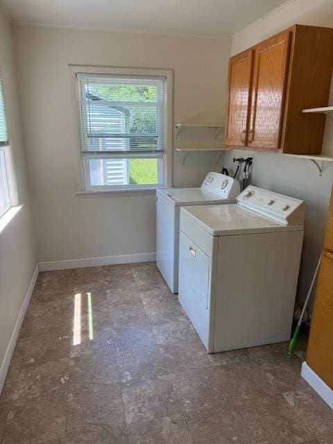 324 Elmwood Ln, Antioch, IL 60002 - washroom with washing machine and dryer, cabinet space, crown molding, and light floors
