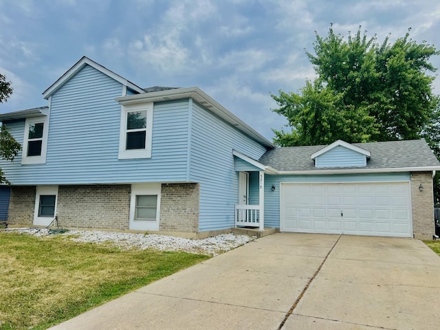 3219 Quincy Ct, Joliet, IL 60431 - tri-level home featuring brick siding, a garage, concrete driveway, a front lawn, and a shingled roof