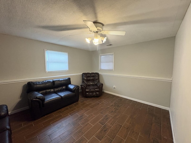 3219 Quincy Ct, Joliet, IL 60431 - sitting room featuring ceiling fan, dark wood-style floors, and a textured ceiling