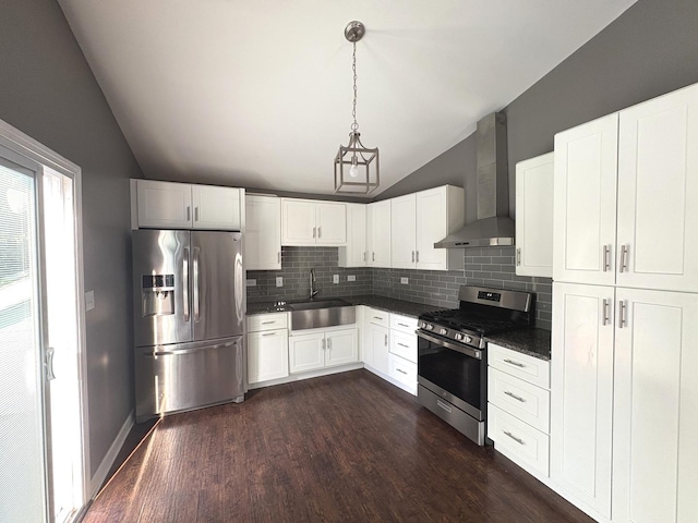 3219 Quincy Ct, Joliet, IL 60431 - kitchen featuring appliances with stainless steel finishes, lofted ceiling, wall chimney exhaust hood, dark countertops, and backsplash