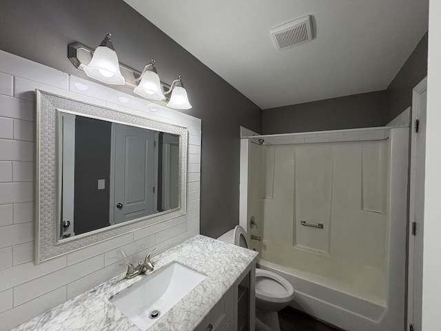 3219 Quincy Ct, Joliet, IL 60431 - full bath with vanity, shower / bathtub combination, and tasteful backsplash