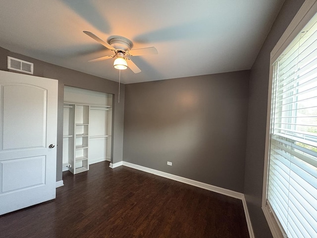 3219 Quincy Ct, Joliet, IL 60431 - unfurnished bedroom featuring dark wood finished floors, a closet, and ceiling fan