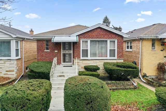 5261 N Natchez Ave, Chicago, IL 60656 - view of front facade featuring brick siding and roof with shingles