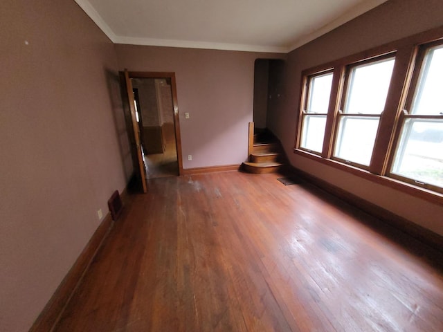 2221 Home Ave, Berwyn, IL 60402 - empty room featuring wood finished floors, crown molding, and stairway
