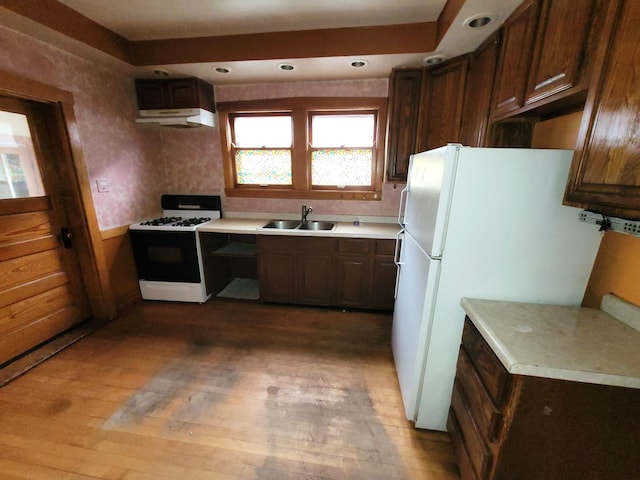 2221 Home Ave, Berwyn, IL 60402 - kitchen with white appliances, under cabinet range hood, light countertops, light wood-style flooring, and recessed lighting