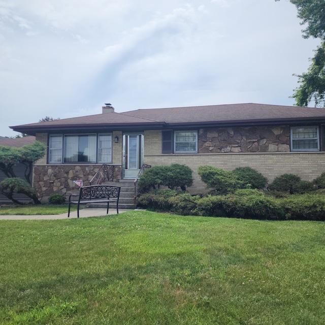 5549 W 83rd Pl, Burbank, IL 60459 - view of front of home featuring a front yard, a chimney, and brick siding