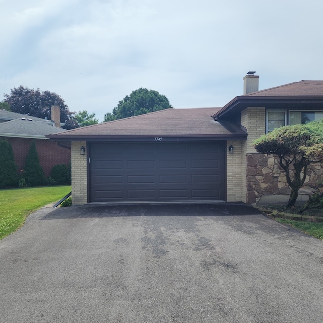 5549 W 83rd Pl, Burbank, IL 60459 - garage with asphalt driveway
