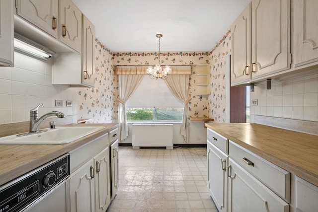7033 N Kedzie Ave Unit 911, Chicago, IL 60645 - kitchen with dishwasher, a chandelier, backsplash, butcher block countertops, and pendant lighting