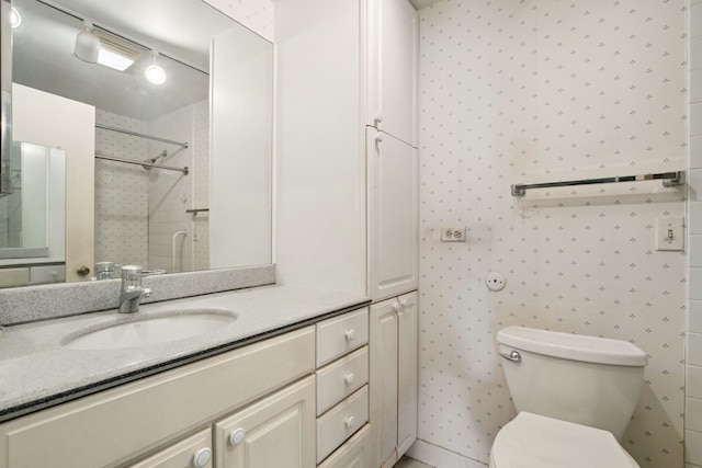 7033 N Kedzie Ave Unit 911, Chicago, IL 60645 - bathroom with vanity, a shower, and wallpapered walls