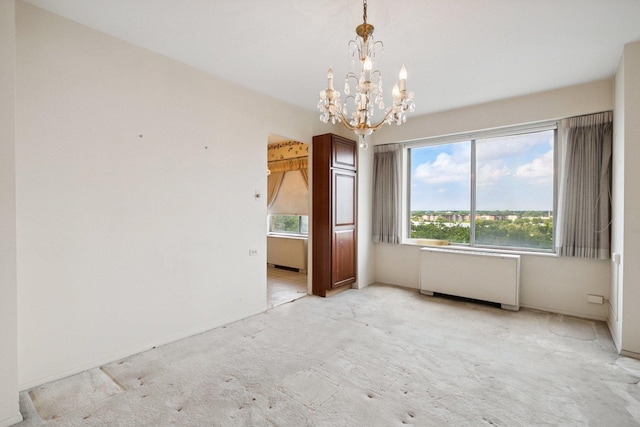 7033 N Kedzie Ave Unit 911, Chicago, IL 60645 - spare room with light carpet, a chandelier, and radiator heating unit