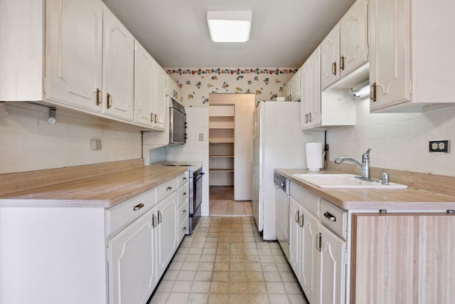7033 N Kedzie Ave Unit 911, Chicago, IL 60645 - kitchen featuring stainless steel appliances, backsplash, light countertops, and white cabinets