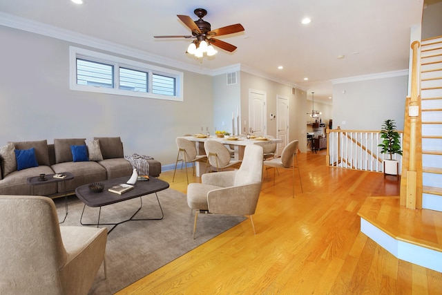 1915 N Albany Ave, Chicago, IL 60647 - living area featuring light wood finished floors, ceiling fan, recessed lighting, and ornamental molding