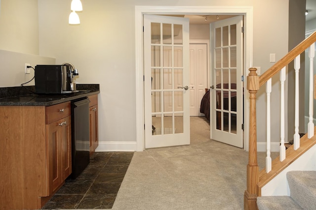 1915 N Albany Ave, Chicago, IL 60647 - kitchen featuring french doors, brown cabinetry, dark countertops, and dark colored carpet