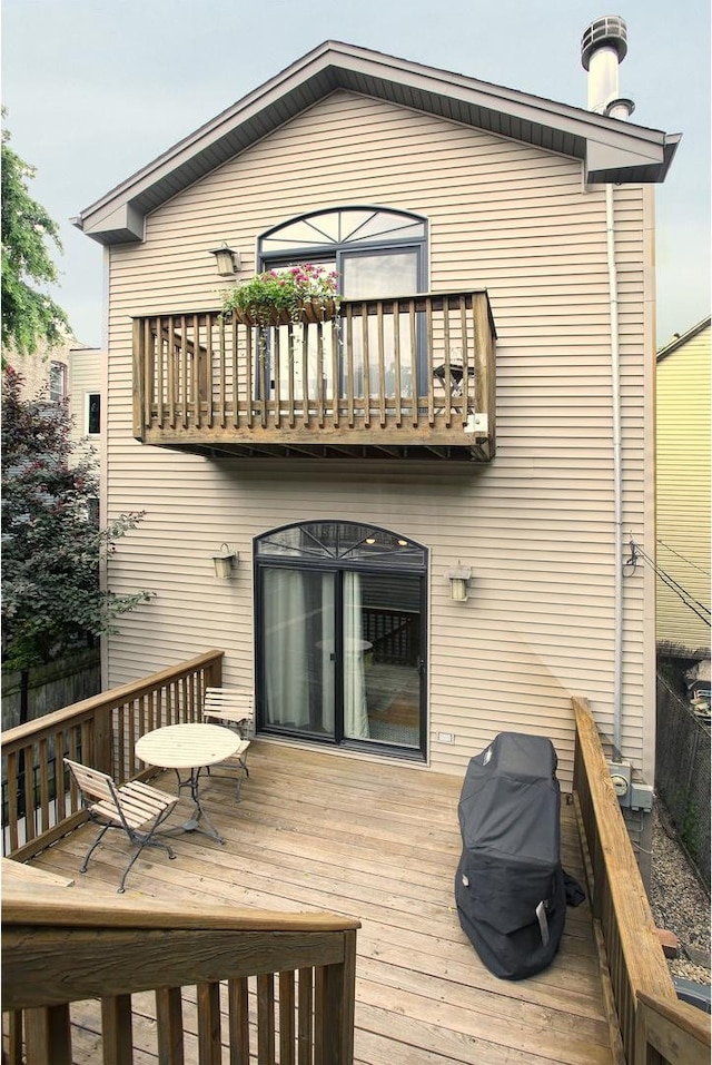 1915 N Albany Ave, Chicago, IL 60647 - rear view of house with a balcony and a deck