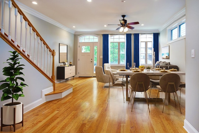1915 N Albany Ave, Chicago, IL 60647 - dining space with crown molding, stairs, light wood-style flooring, a ceiling fan, and recessed lighting
