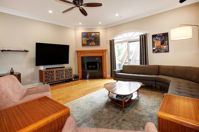 1915 N Albany Ave, Chicago, IL 60647 - living room featuring a ceiling fan, wood finished floors, recessed lighting, a premium fireplace, and crown molding