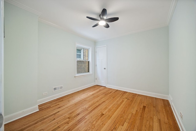 8623 S Prairie Ave, Chicago, IL 60619 - unfurnished room featuring light wood-style floors, a ceiling fan, and crown molding