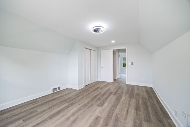 8623 S Prairie Ave, Chicago, IL 60619 - additional living space with vaulted ceiling and wood finished floors