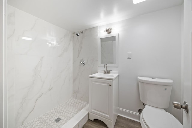 8623 S Prairie Ave, Chicago, IL 60619 - bathroom featuring vanity, a marble finish shower, and wood finished floors