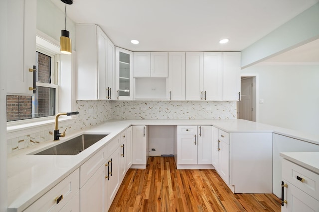 8623 S Prairie Ave, Chicago, IL 60619 - kitchen with tasteful backsplash, white cabinetry, decorative light fixtures, light wood-style floors, and recessed lighting