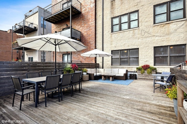 2107 W Belmont Ave Unit 2C, Chicago, IL 60618 - wooden deck with outdoor dining space and an outdoor living space