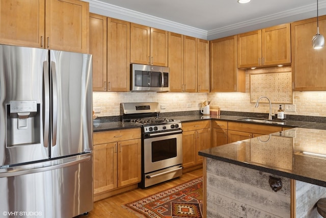 2107 W Belmont Ave Unit 2C, Chicago, IL 60618 - kitchen featuring stainless steel appliances, light wood-type flooring, dark stone countertops, backsplash, and ornamental molding
