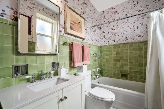 3750 N Lake Shore Dr Unit 16H, Chicago, IL 60613 - bathroom featuring wallpapered walls, tile walls, vanity, and shower / tub combo
