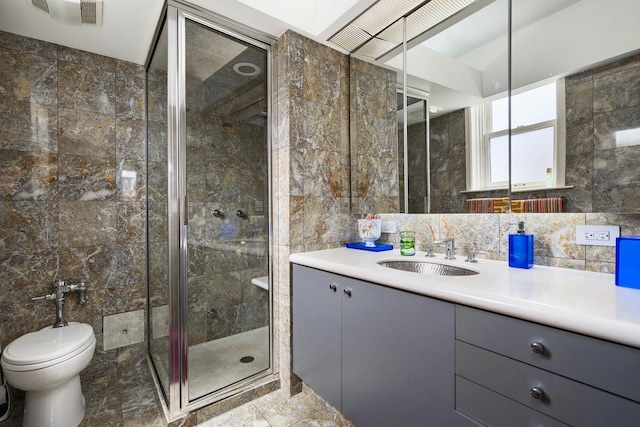 3750 N Lake Shore Dr Unit 16H, Chicago, IL 60613 - bathroom featuring tile walls, a stall shower, and vanity