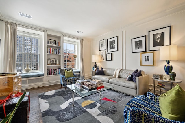 3750 N Lake Shore Dr Unit 16H, Chicago, IL 60613 - living area with wood finished floors, built in shelves, and crown molding