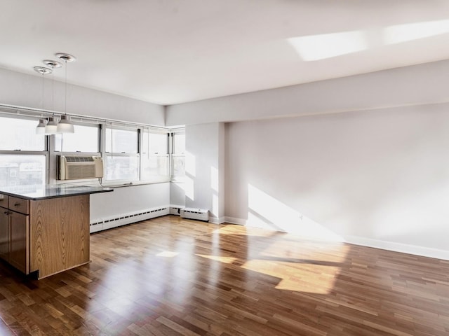 4960 N Marine Dr Unit 616, Chicago, IL 60640 - unfurnished living room featuring a baseboard radiator, cooling unit, dark wood-style flooring, and baseboard heating