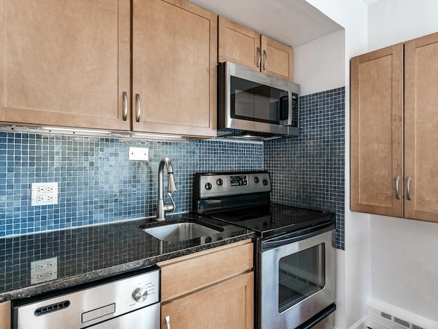 4960 N Marine Dr Unit 616, Chicago, IL 60640 - kitchen featuring appliances with stainless steel finishes, tasteful backsplash, a baseboard heating unit, and dark stone counters