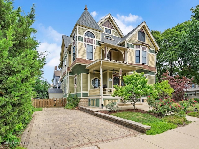 442 Du Page St, Elgin, IL 60120 - victorian house with covered porch and a shingled roof
