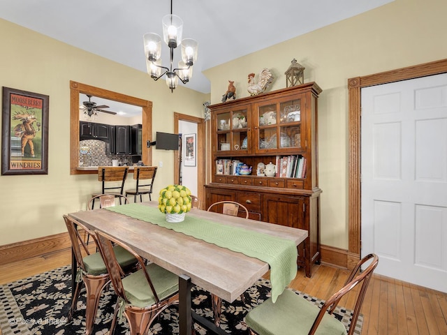 442 Du Page St, Elgin, IL 60120 - dining area featuring light wood-style floors, a chandelier, and a ceiling fan