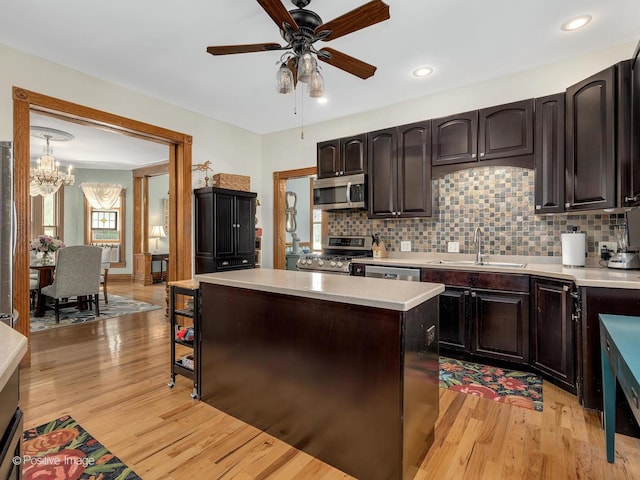 442 Du Page St, Elgin, IL 60120 - kitchen with stainless steel appliances, a chandelier, light countertops, a ceiling fan, and light wood-type flooring