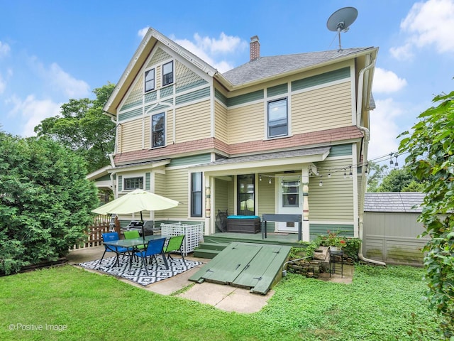 442 Du Page St, Elgin, IL 60120 - rear view of property featuring a yard, a chimney, and a shingled roof