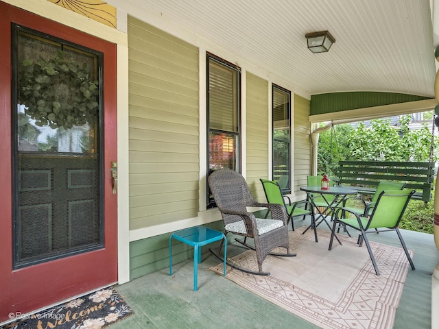 442 Du Page St, Elgin, IL 60120 - covered porch with outdoor dining area