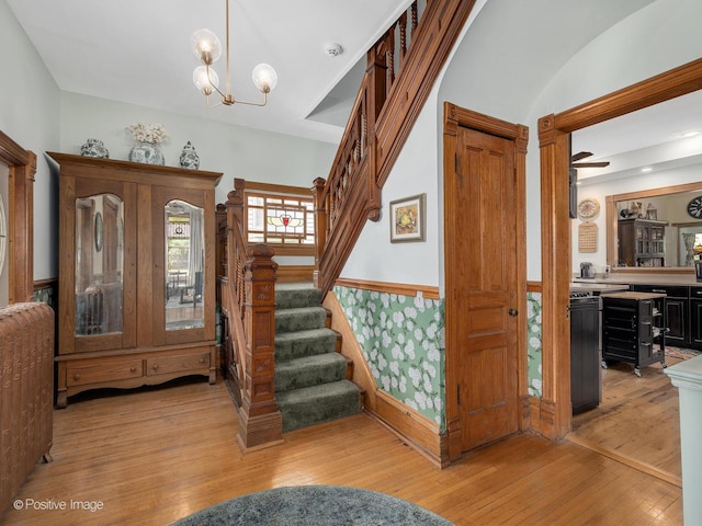 442 Du Page St, Elgin, IL 60120 - stairs featuring hardwood / wood-style flooring and a chandelier