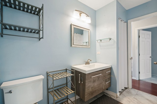 2125 Leeward Ln, Hanover Park, IL 60133 - bathroom featuring vanity and marble finish flooring