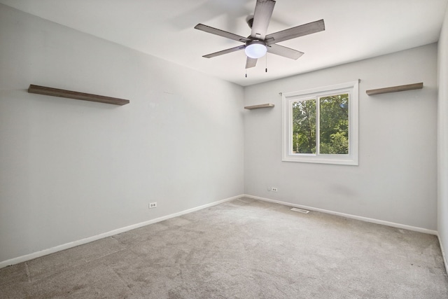 2125 Leeward Ln, Hanover Park, IL 60133 - empty room with carpet floors and ceiling fan