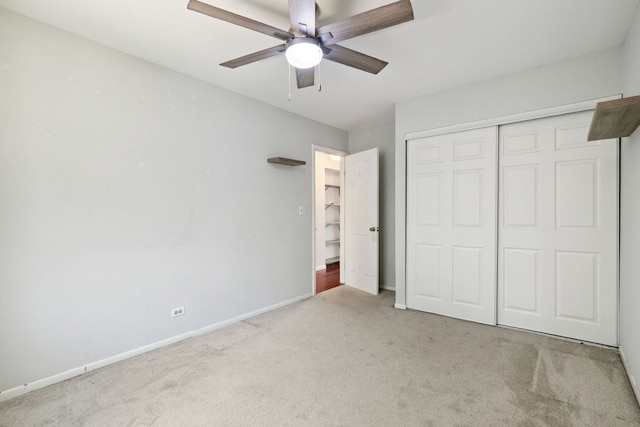 2125 Leeward Ln, Hanover Park, IL 60133 - unfurnished bedroom featuring carpet, a closet, and a ceiling fan