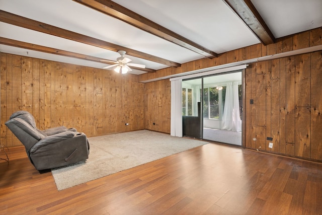 2125 Leeward Ln, Hanover Park, IL 60133 - unfurnished room featuring wooden walls, beam ceiling, wood finished floors, and a ceiling fan