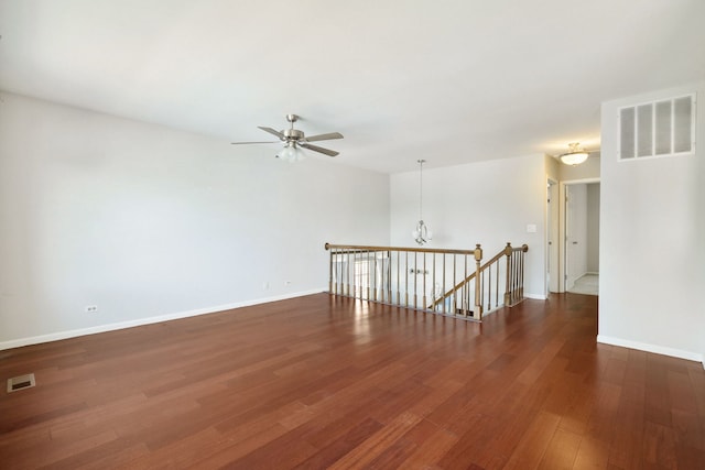2125 Leeward Ln, Hanover Park, IL 60133 - empty room featuring ceiling fan, wood finished floors, and a chandelier
