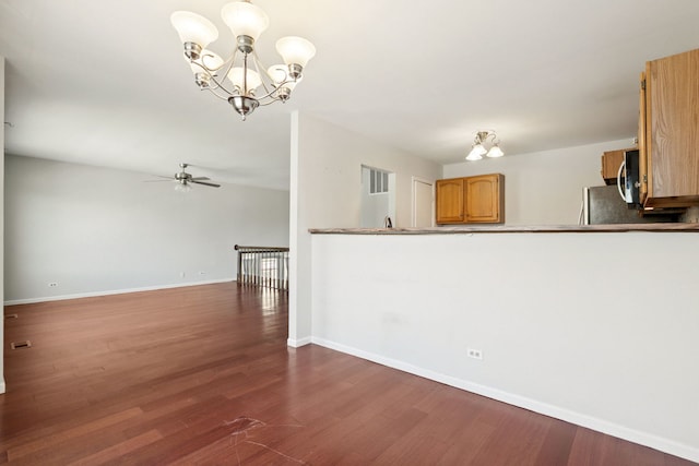 2125 Leeward Ln, Hanover Park, IL 60133 - kitchen featuring a chandelier, dark wood finished floors, ceiling fan, and stainless steel microwave