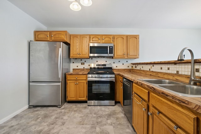 2125 Leeward Ln, Hanover Park, IL 60133 - kitchen featuring stainless steel appliances and decorative backsplash