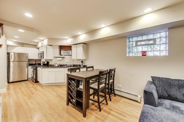 3117 N Orchard St Unit Ge, Chicago, IL 60657 - dining space with baseboard heating, light wood-style flooring, and recessed lighting