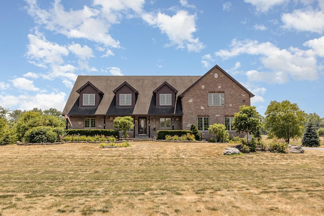 8741 W Blackthorne Way, Frankfort, IL 60423 - cape cod house featuring a front yard and brick siding