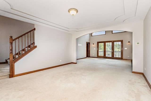 8741 W Blackthorne Way, Frankfort, IL 60423 - unfurnished room featuring arched walkways, light carpet, and stairs