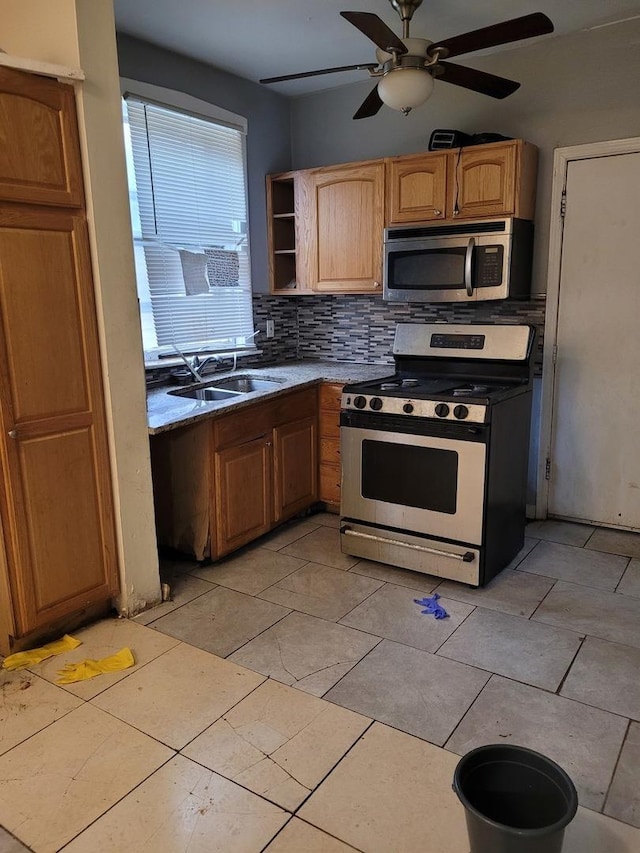 7655 S Clyde Ave, Chicago, IL 60649 - kitchen with appliances with stainless steel finishes, a ceiling fan, decorative backsplash, and open shelves