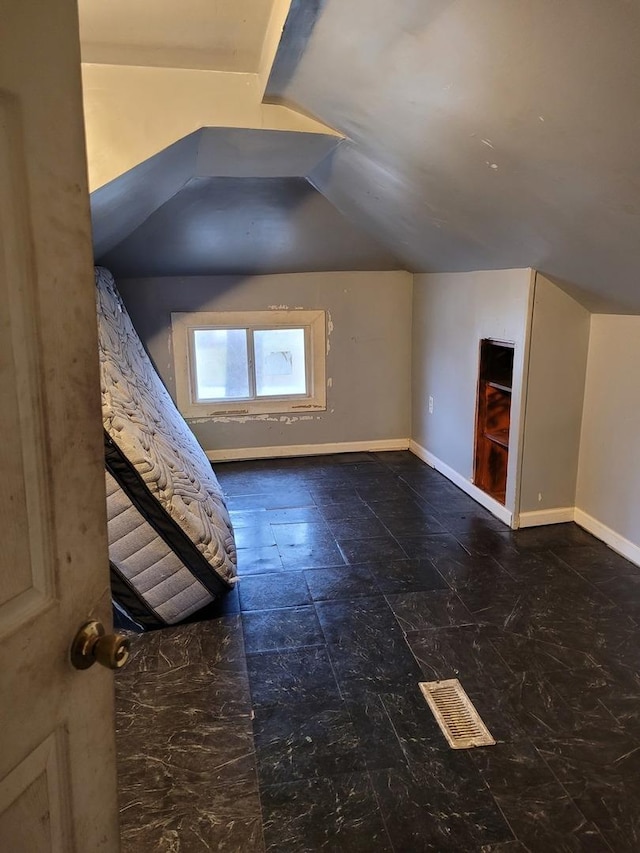 7655 S Clyde Ave, Chicago, IL 60649 - additional living space with vaulted ceiling and baseboards