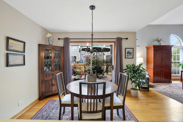874 Dandridge Ct, Elgin, IL 60120 - dining space featuring a chandelier and light wood-type flooring
